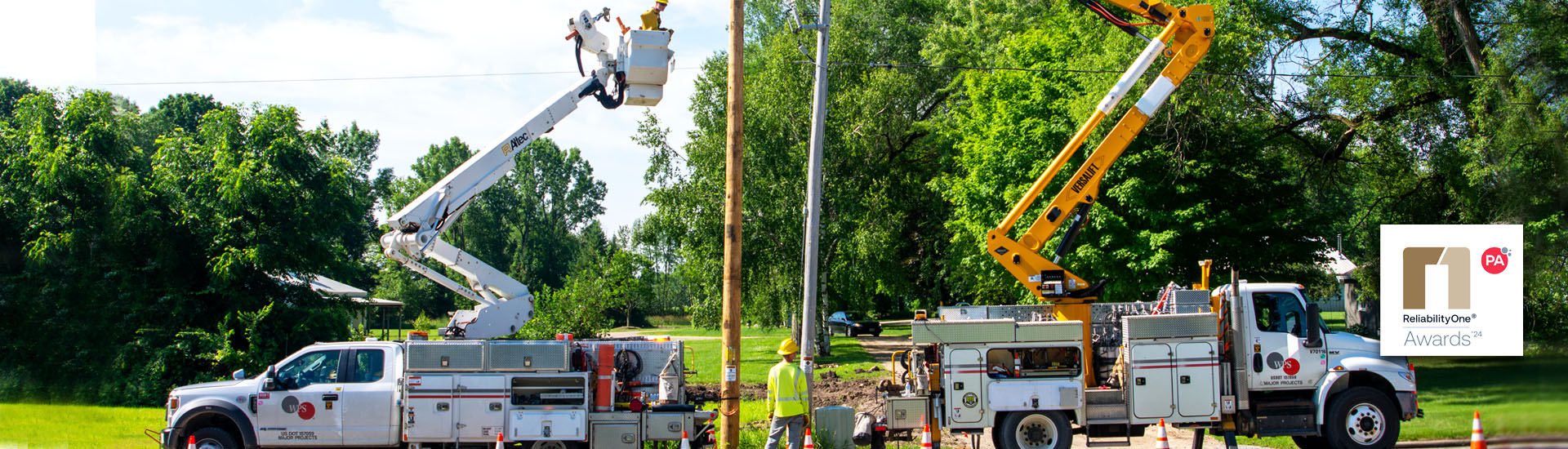 bucket trucks next to pole